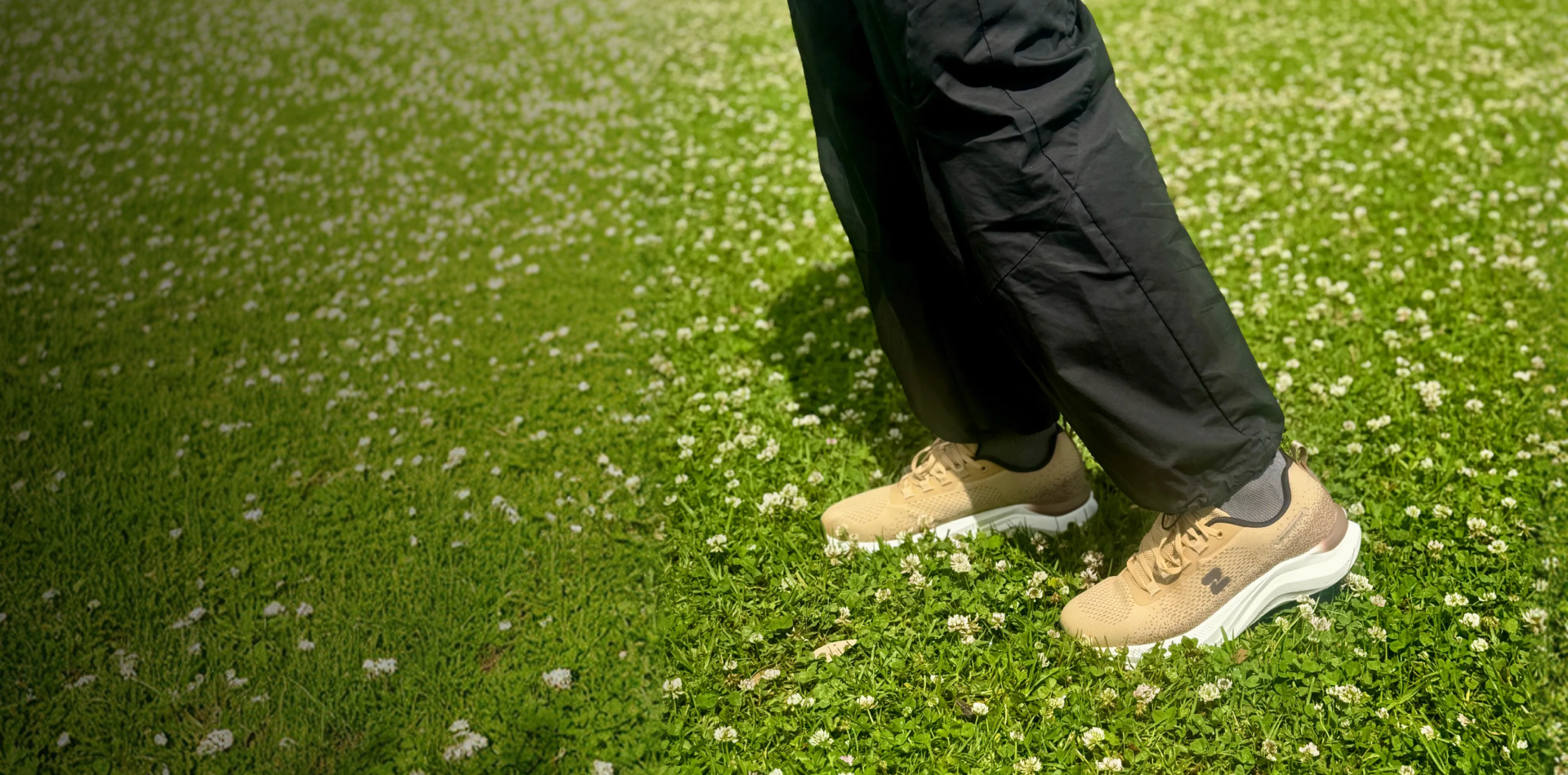 Beige Tasman Essentials on wet grass