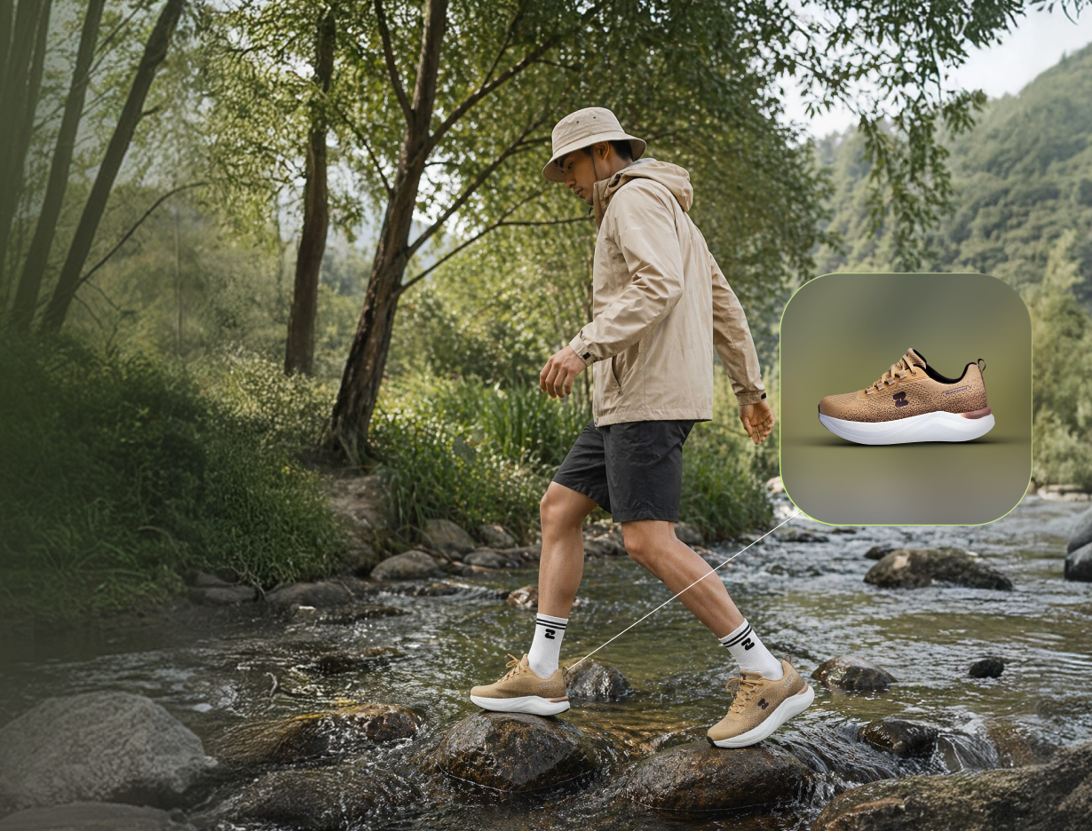 Walking across stepping stones in a stream wearing Tasman Essentials